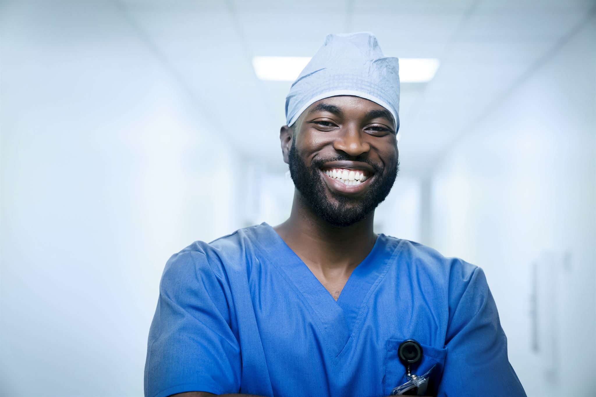 Portrait-of-smiling-nurse-in-scrubs